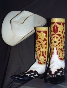 custom made black white yellow and red boots and a white cowboy hat from country music hall of famer carl smith