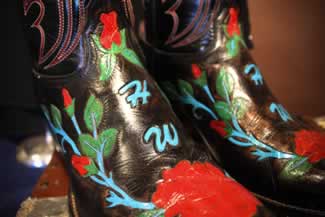 hank williams jur nudie designed musical shirt aling with his custom made monogaammed boots 3