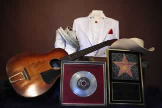 ferlin huskys  includes his  guitar rhinestone guitar strap and hollywood walk of fame award 