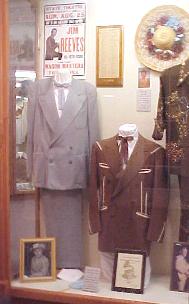 display honoring jim reeves contains two of his suits a record award and a grammy nomination plaque
